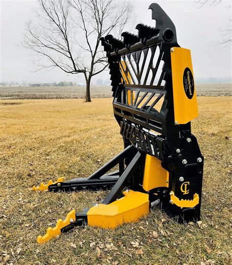 cat skid steer tree puller|tree puller attachment for tractor.